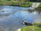Girls splashing across the ford.
