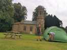 Setting up our tent by the chapel. beautiful view.