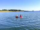 Having a swim in the lake while kayaking