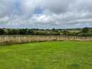 View from the pitch, grass to pitch tents etc. was fairly level but need chocks for large van