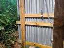 Outdoor shower area with warm water, locking doors, shelves and hooks for practicality.