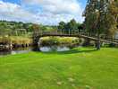 Bridge over river to play area