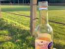 Watching rugby training with a cider for the campsite