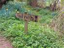 Footpath past the old watermill near the site entrance.