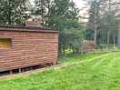 Shower and toilet to the right of the shepherds hut.