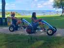 Mom and daughter scooting around on rental buggies