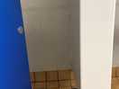 Small shower with grubby shower curtain