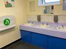 Clean sinks and cleaning products left for campers to clean up after themselves.