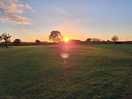 Sunset across campingg field