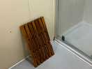 Wooden floor mat in cubicle