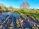 Stream next to pitch