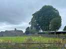 View of the farmhouse from the site