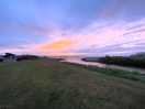 Sunset over the sea view from the tent field.