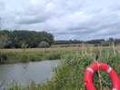 River and next field over with sheep. there is a ring to throw into the water if someone needs help