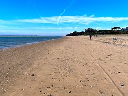 On beach which is 2 mins walk.