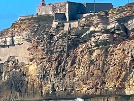 The lighthouse where the famous waves are.