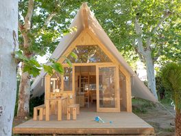 Tipi on a wooden deck among the trees