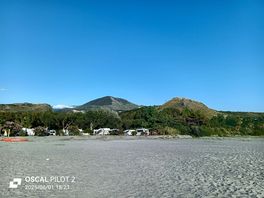 View from the beach back to the site