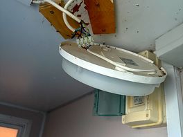 Exposed wires in bathroom next to shower