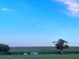 As night falls on the campsite.