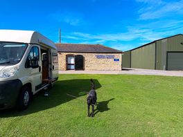 Daisy outside the van and the museum