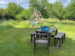 Children’s swing and communal tables