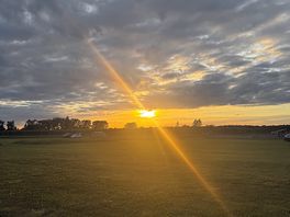 View of camping field at sunset