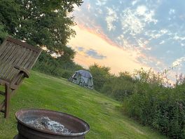 Sunset clouds. a fire pit is provided at each pitch, and furniture can be moved around as necessary.