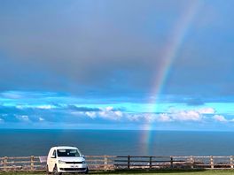 Campervan at crows nest with rainbow