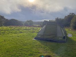 Simple camping tent pitch with firepit