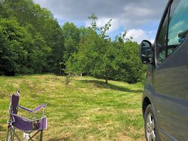 Peaceful site surrounded by trees.