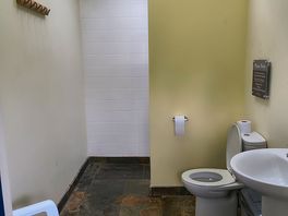 Unisex shower/toilet cubilce