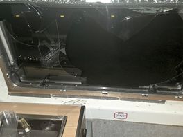 Damaged caused by brick thrown though window