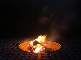 Roaring fire in the fire pit table