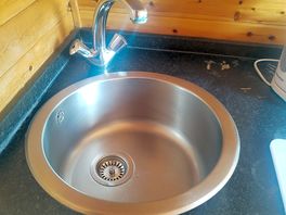 A lot of limescale on tap and some marks around.