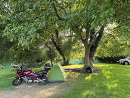 Motorcycle next to tent