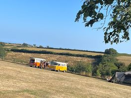 Vans in field