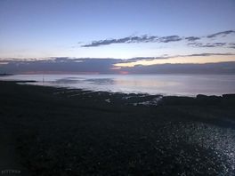 Nighttime at beach behind site
