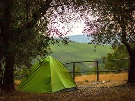 Tent pitch with a view of the hills