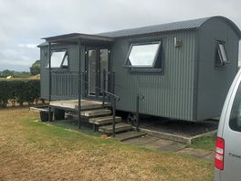 Delightful shepherd’s hut with picnic table and ample car parking space.