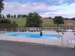 Lovely clean swimming pool area with ample loungers and fully fenced for safety.