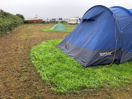 Cut grass around tents with wet clippings splattering all over tents!