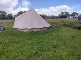 Most remote pitch only for tents, alongside woods in upper solar field