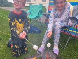 Toasting marshmallows on the fire