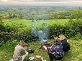 Cooking over the fire in the evening
