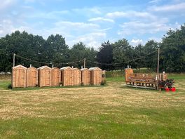 The toilets and showers are in these cute cabins