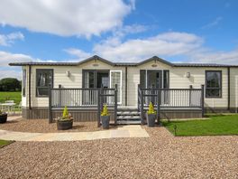 Lodge with parking, decking and private garden