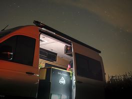 Night sky with the camper van and fire pit