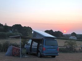 Campervan and tent at sunrise