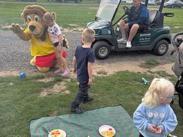 Lion mascot came round to pitches to see the kids